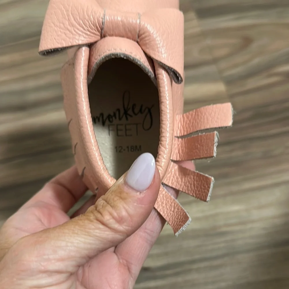 Monkey feet pink bow moccasins size 12-18 months